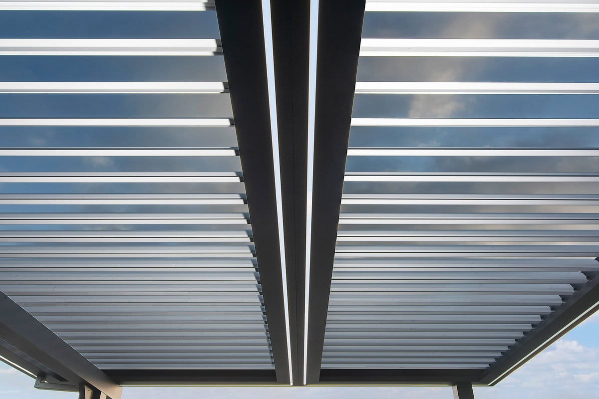 Close-up view of louvers after cleaning demonstrating how to clean louvered pergola for powder-coated maintenance.