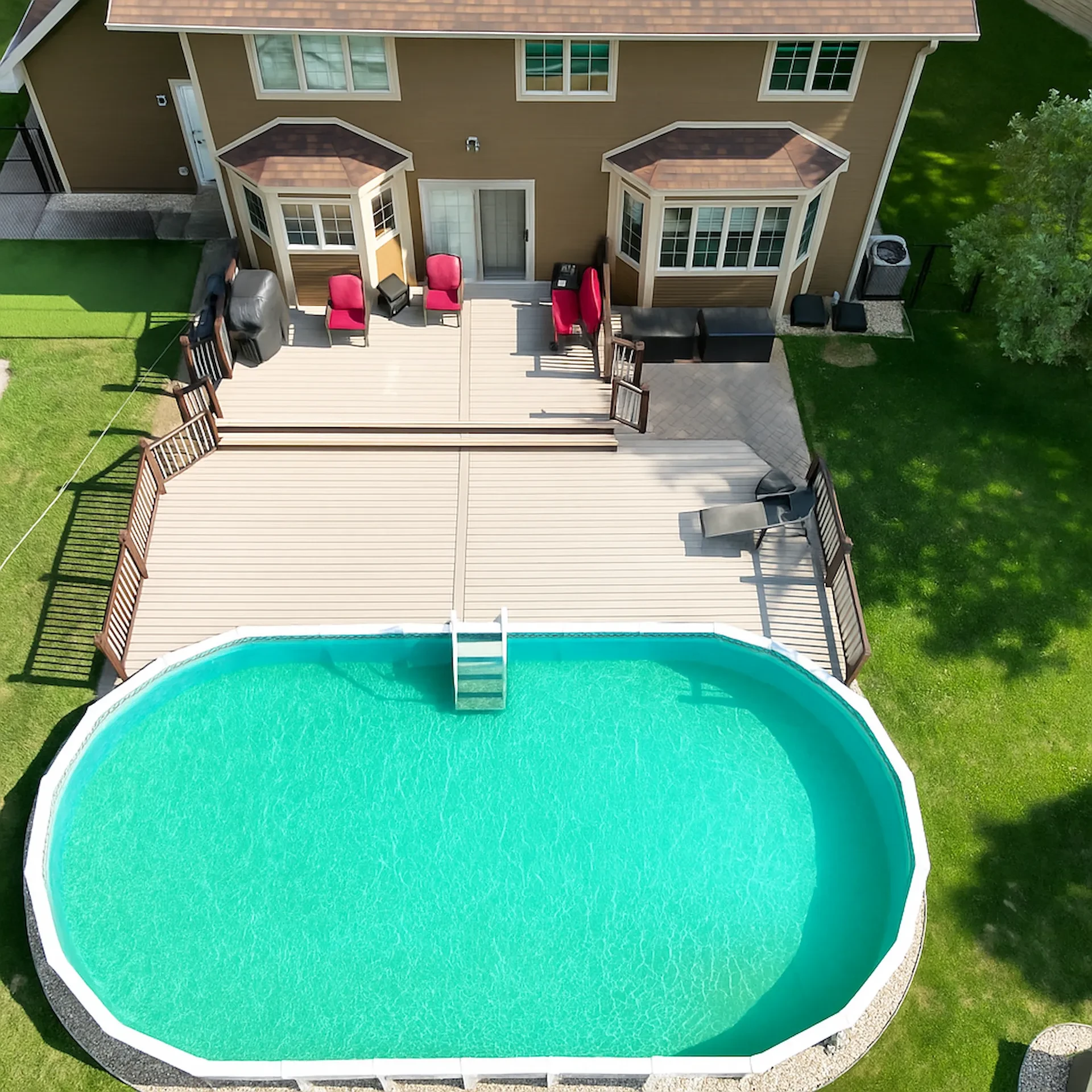 Trex composite pool deck with an above ground pool.
